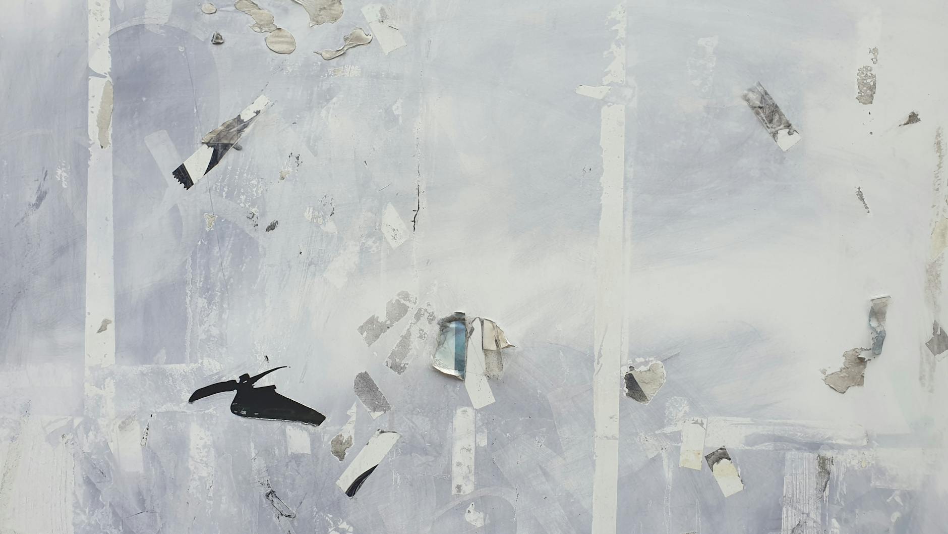 Minimalist abstract grunge wall with peeling textures and tape remnants.