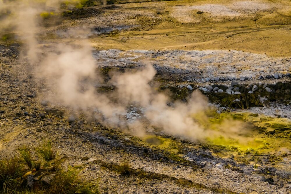 A stunning aerial capture of a geothermal landscape with steam vents in Taipei, Taiwan.