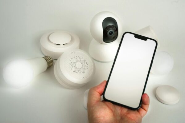 Showcase of various smart home devices controlled via a smartphone, highlighting automation and security.
