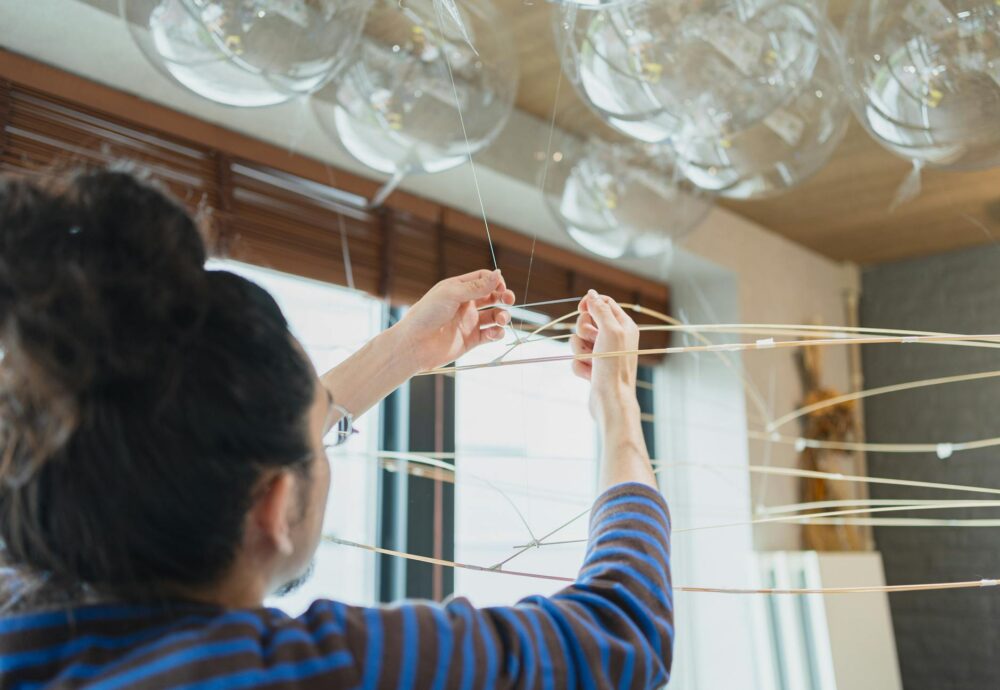 Artist working on a contemporary art installation inside a Shinjuku studio, Tokyo, Japan.