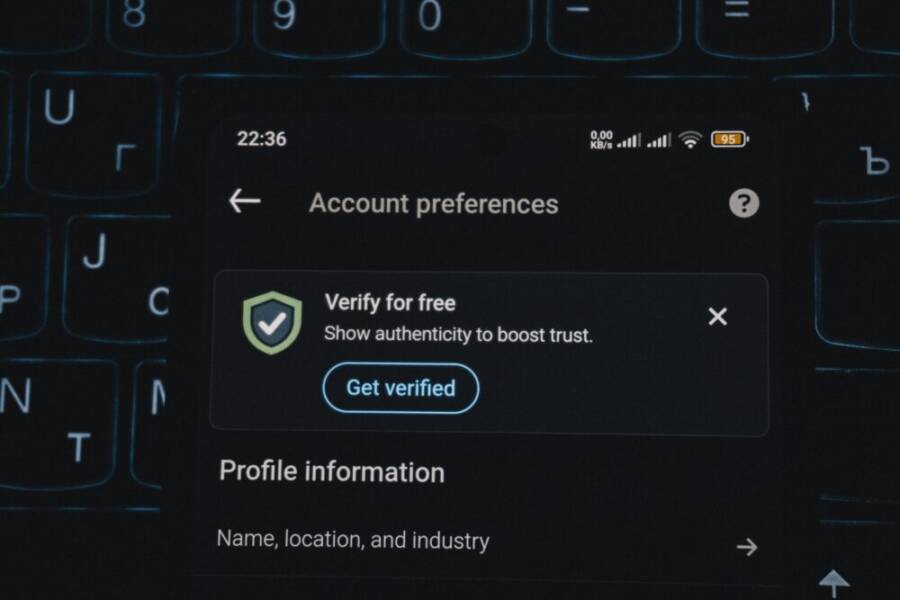 Close-up of a smartphone screen displaying account verification alert.