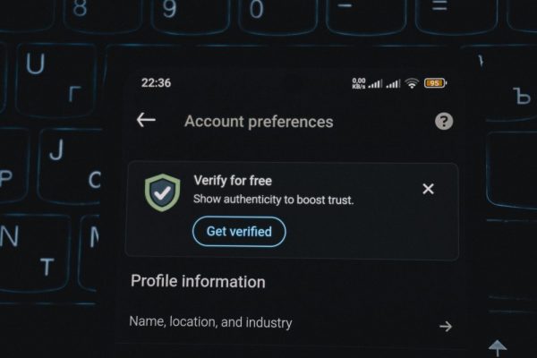 Close-up of a smartphone screen displaying account verification alert