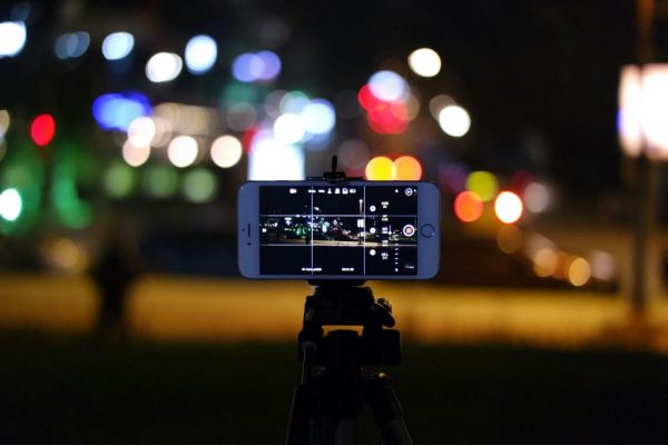 Night scene captured on smartphone with bokeh lighting effect for creative photography.
