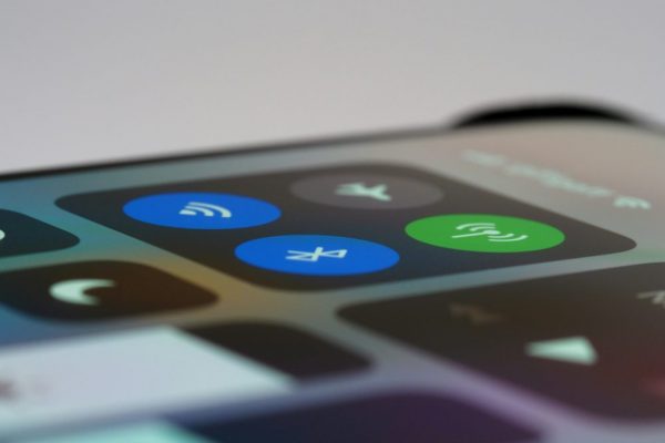 Detailed view of a smartphone control center showing wireless icons, perfect for tech-related topics.