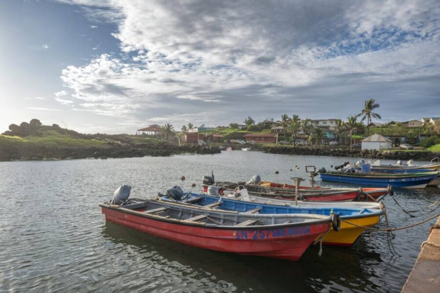 Vibrant fishing boats moored at a scenic harbor in Valparaíso, Chile