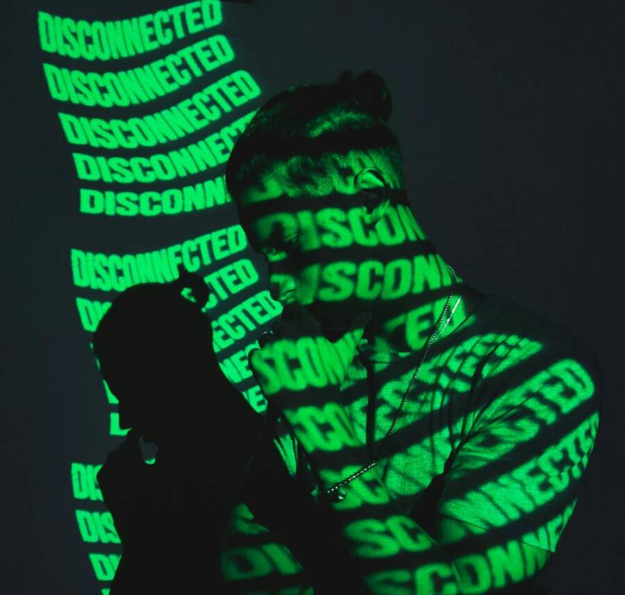 A man stands in shadow with