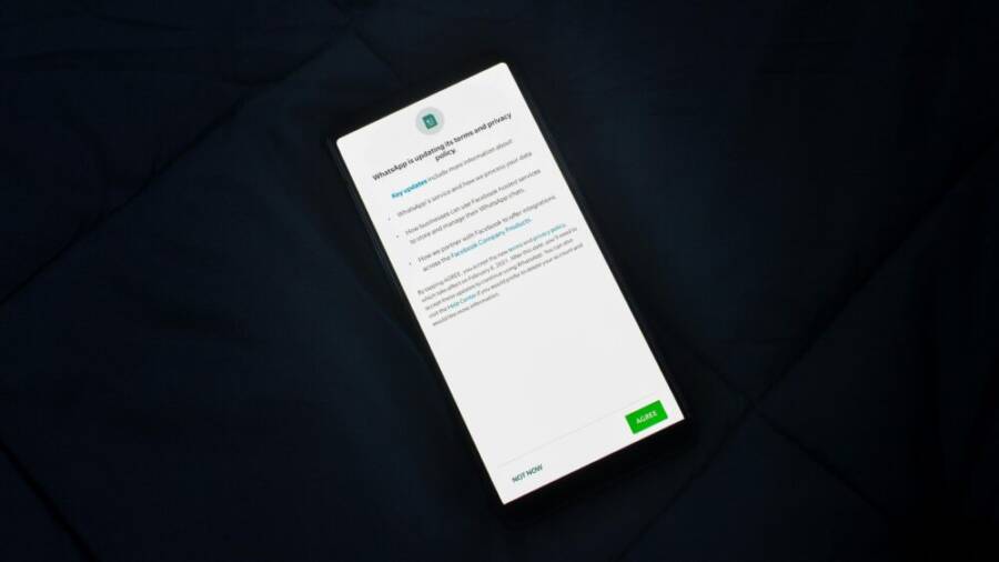 Close-up of smartphone screen showing a privacy policy update agreement